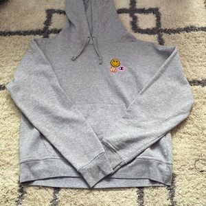 Gray small champion hoodie with patches on shoulder